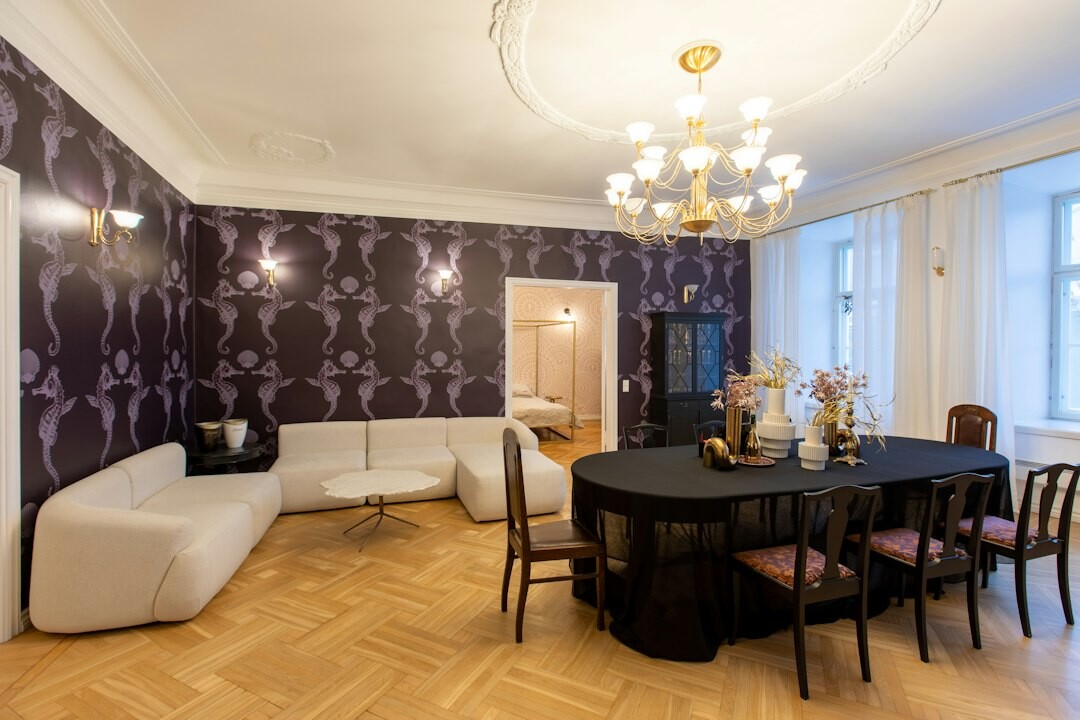 Retro 1980s living room with patterned wallpaper and vintage furniture